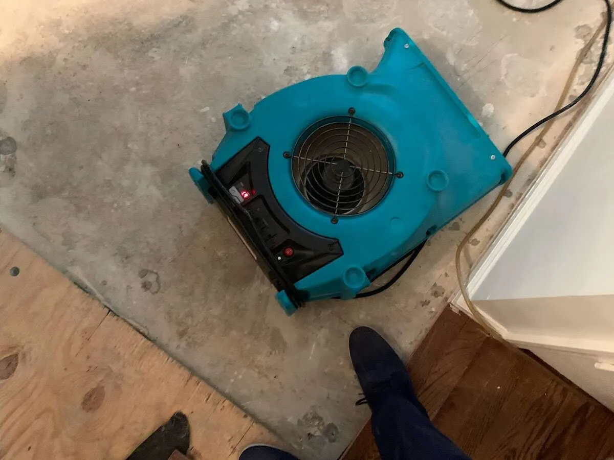 Air mover drying subfloor during Leak Detection & Repair in Upper Sandusky